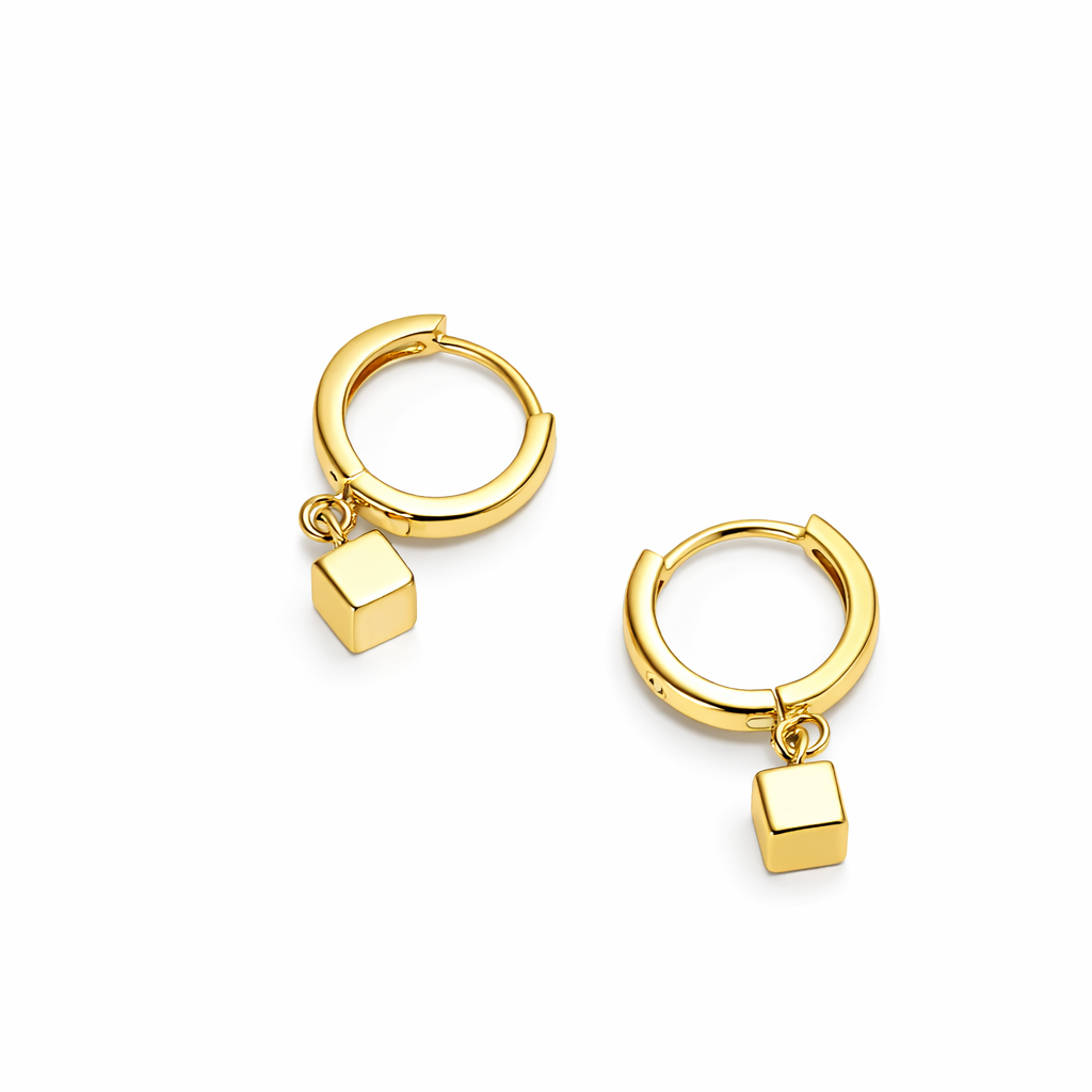 Gold earrings with square pendants.