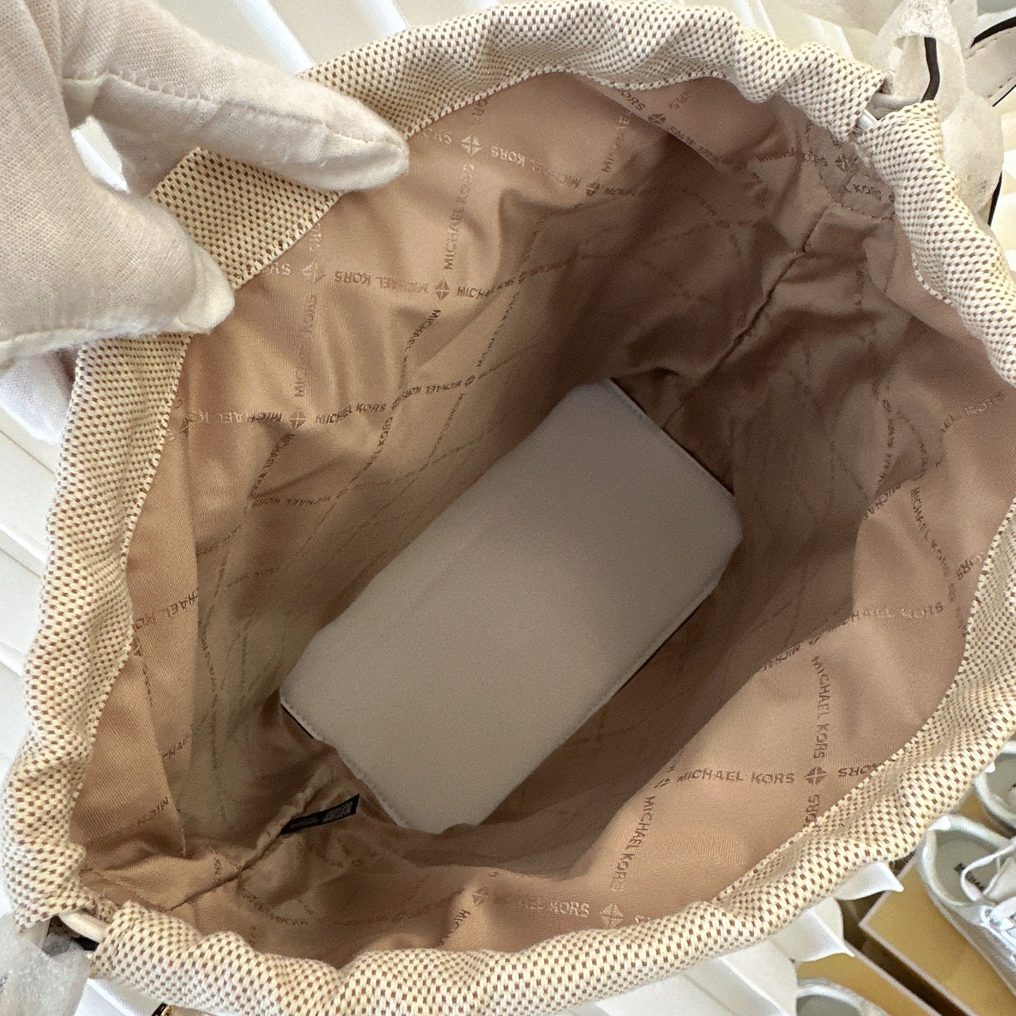 Michael Kors Eden straw drawstring bucket bag.