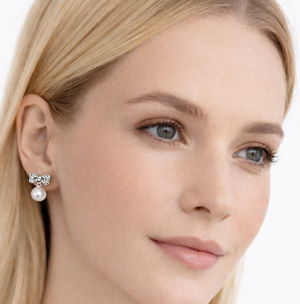 Crystal bow and pearl pendant earrings