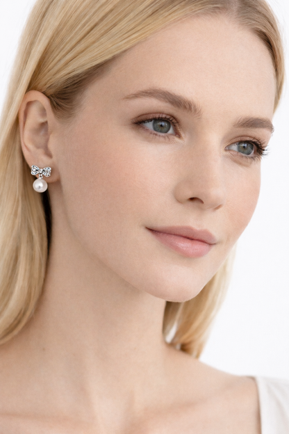 Crystal bow and pearl pendant earrings