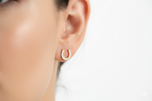 White enamel gold horseshoe stud earrings