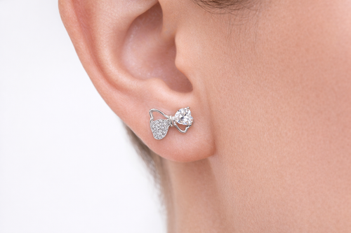 Silver bow stud earrings