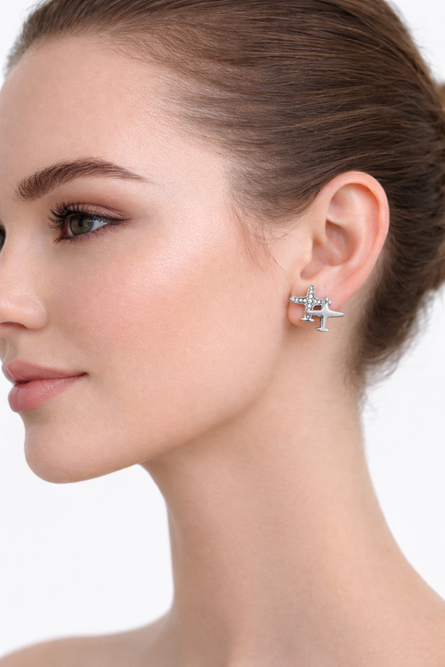 Diamond-encrusted airplane-style earrings