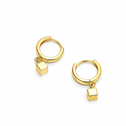 Gold earrings with square pendants.