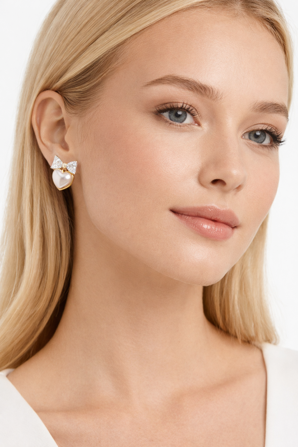 Bow modelling Heart-shaped pearl earrings