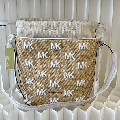 Michael Kors Eden straw drawstring bucket bag.