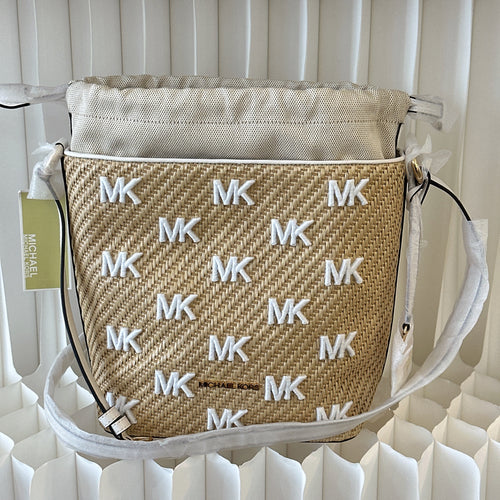 Michael Kors Eden straw drawstring bucket bag.
